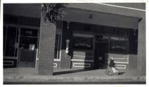 735 Azusa Ave in Arcade Bldg. in Azusa.  Kim Ward Anderson on trike. 1942